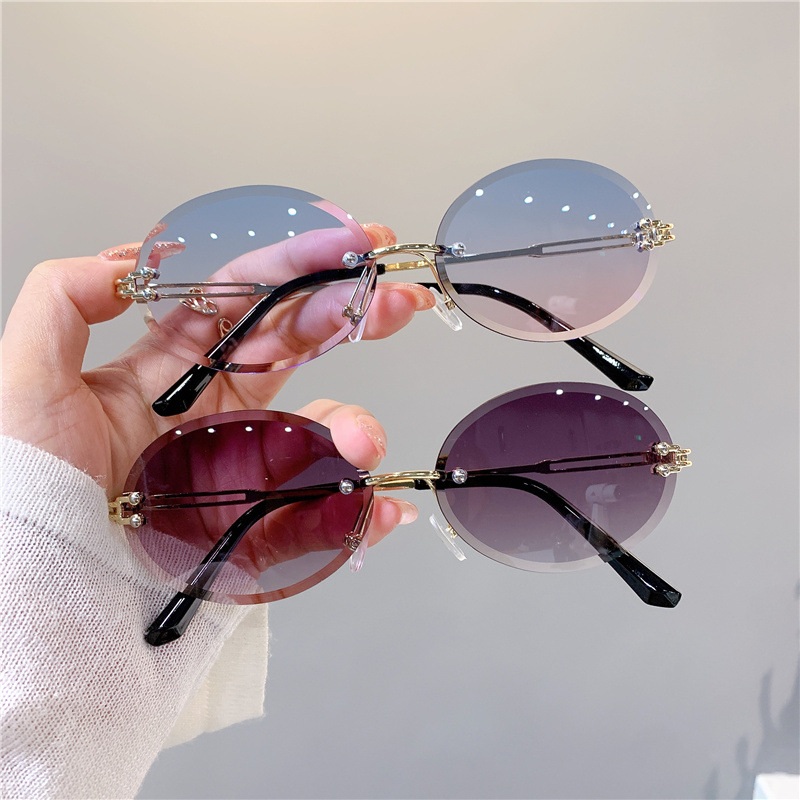 Nuevas gafas de sol transfronterizas para mujer, gafas de sol con degradado rojo ovalado en red, sin marco, gafas de moda al por mayor_voghion.com