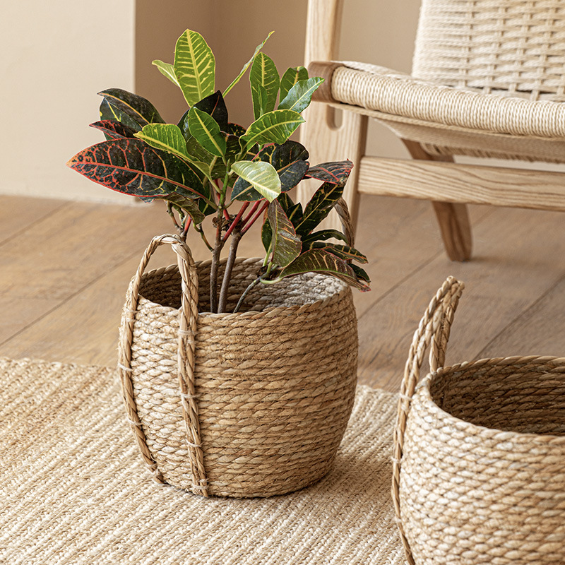Wholesale pastoral style sea grass woven handmade flower basket with handle Rattan woven decorative flower pot large laundry basket clothes collection