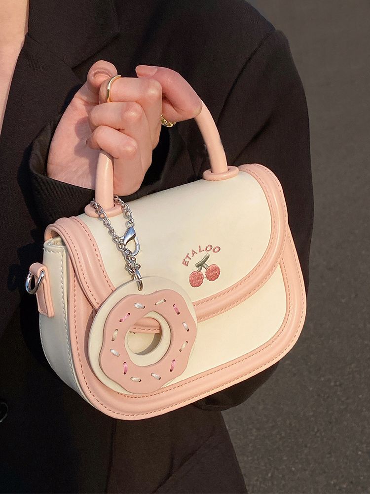 2023 new bag cute junior high school student saddle bag Japanese biscuit creamy-white portable shoulder messenger bag female spring