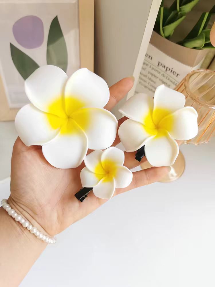 Dai people dress up seaside holiday egg flower hairpin travel photography headdress flower side clip small size fairy hairpin_voghion.com