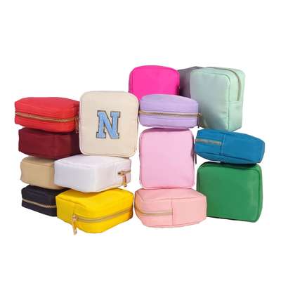 In stock 2023 new travel cosmetic bag aunt towel earphone portable multifunctional nylon travel portable storage