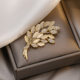 Cat's Eye Stone Wheat Ear High-end Brooch Women's Design Sense Niche Luxury Internet Popular Anti-glare Corsage Pin Buckle Accessories