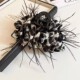 Black and white leopard feather grip clip
