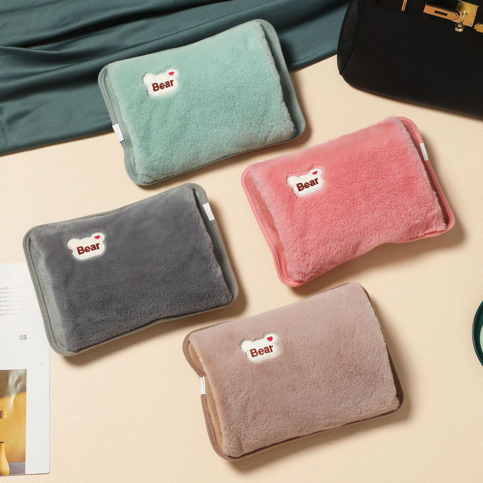 In stock safety explosion-proof charging hot water bag bear head embroidery hand pillow electric heating bag removable and washable hand warmer foreign trade