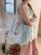Embroidered cake front and back shoulder bag-blue