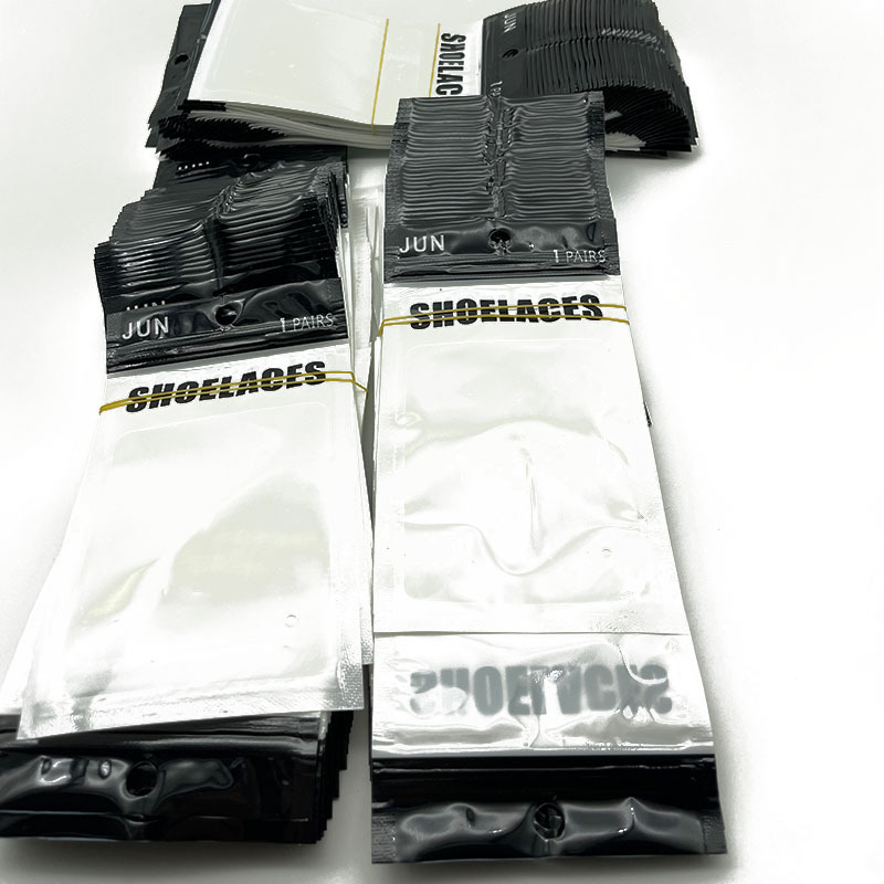 Wholesale self-sealing bag mouth high-end PE rectangular packaging shoelace press buckle magnetic buckle black and white thick decoration