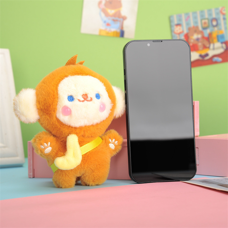 かわいい創意的なリュックサックの掛け物のプレゼントのサルのキーはぬいぐるみのバナナのサルの人形の車のキーチェーンの女性を掛けます。|undefined