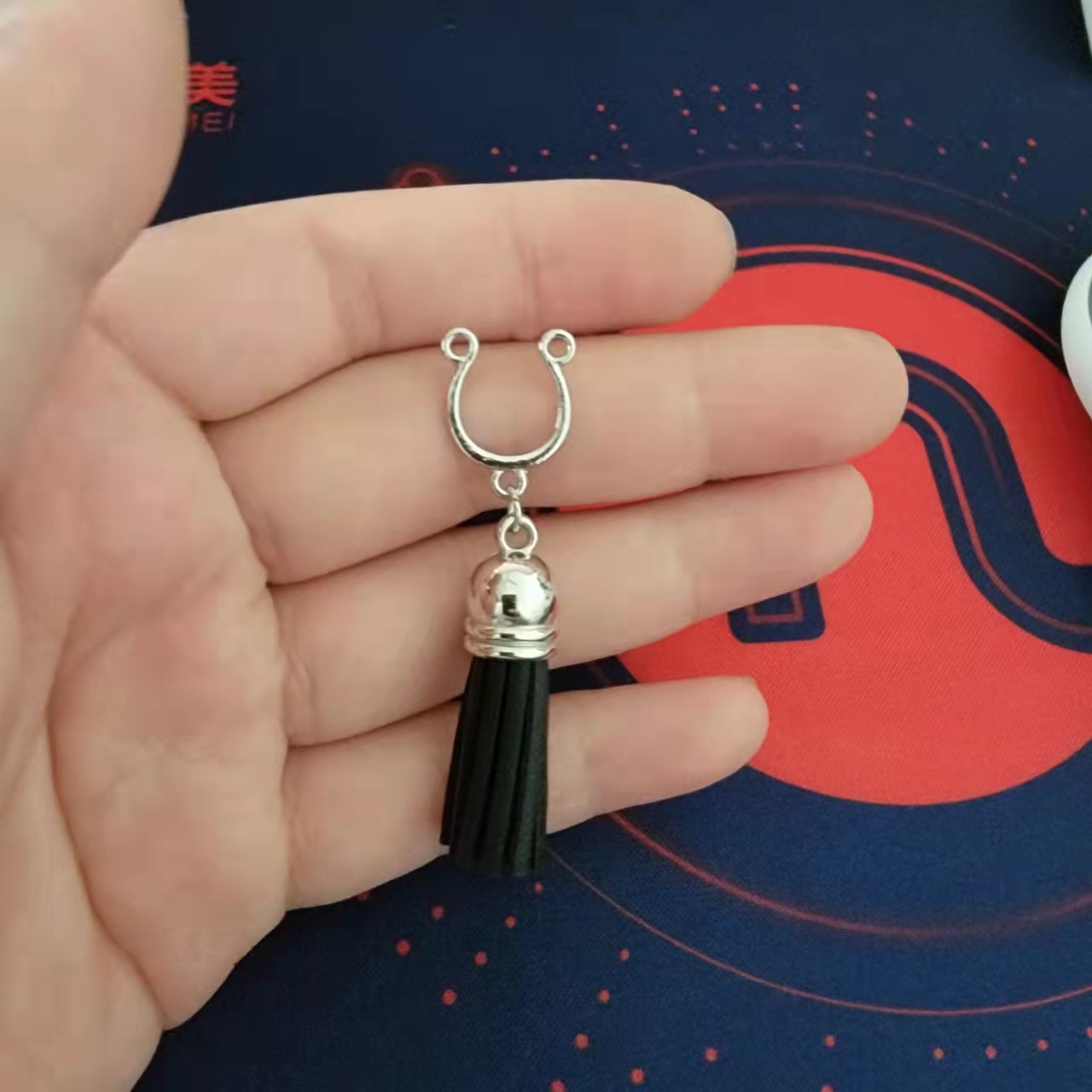 Cross-border e-commerce factory spot Bell tassel milk nail fake breast ring does not puncture symmetrical puncture jewelry chest ornaments