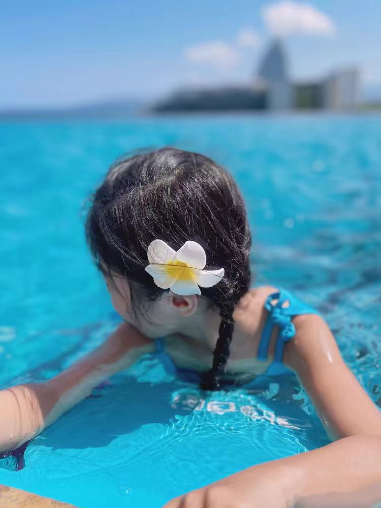 Dai people dress up seaside holiday egg flower hairpin travel photography headdress flower side clip small size fairy hairpin_voghion.com