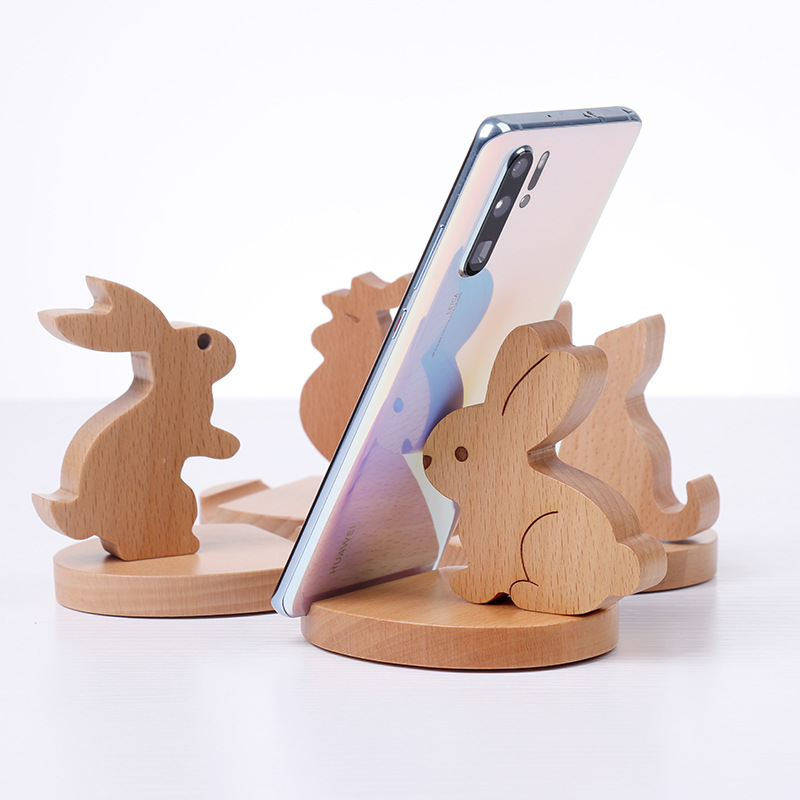 Solid wood flat support to chase TV cute creative mobile phone holder desktop mobile phone holder wholesale engraved logo
