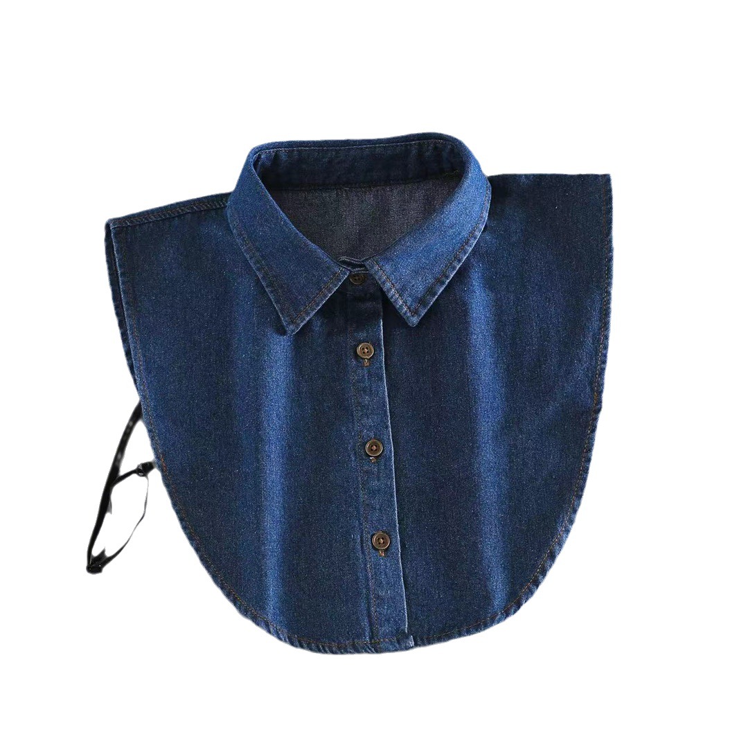 A versatile, light blue denim crew neck sweater with a pseudo-intellectual, cool, and stylish vibe, perfect for layering under a trench coat in autumn and winter.
