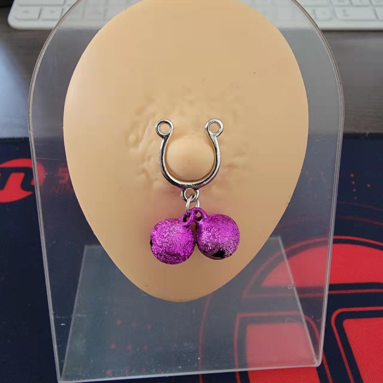 Cross-border e-commerce factory spot Bell tassel milk nail fake breast ring does not puncture symmetrical puncture jewelry chest ornaments