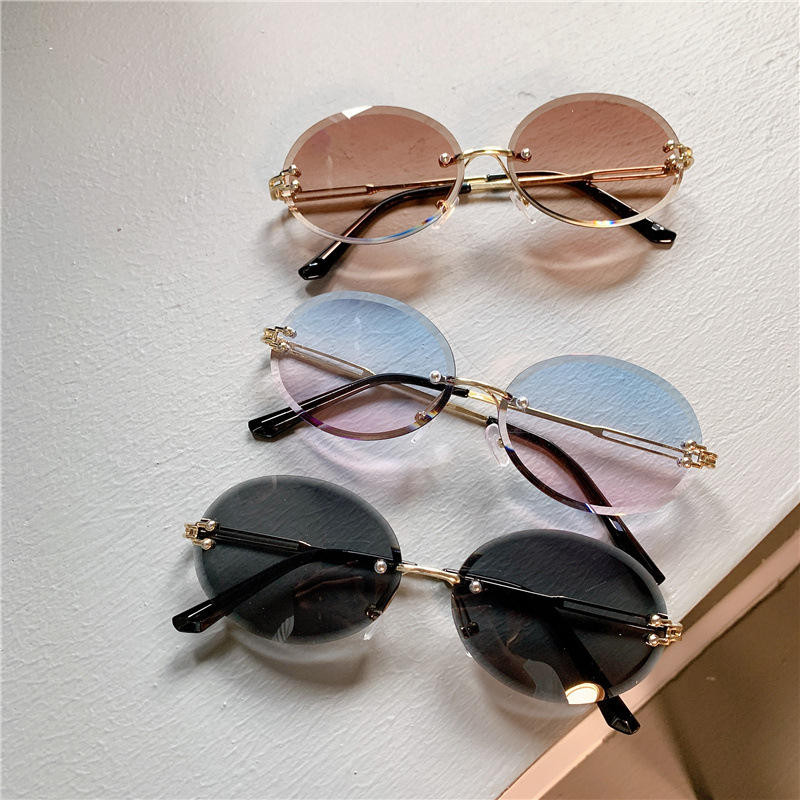Nuevas gafas de sol transfronterizas para mujer, gafas de sol con degradado rojo ovalado en red, sin marco, gafas de moda al por mayor_voghion.com