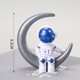 Plastic silver moon blue face astronaut