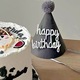Dark gray hairy ball