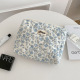 Hand-held cosmetic bag