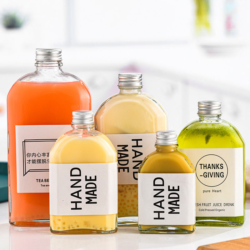 Cross-border glass beverage bottle milk tea bottle empty small wine bottle coffee cold extract bottle sealed fruit wine bottle oblique shoulder flat bottle wholesale