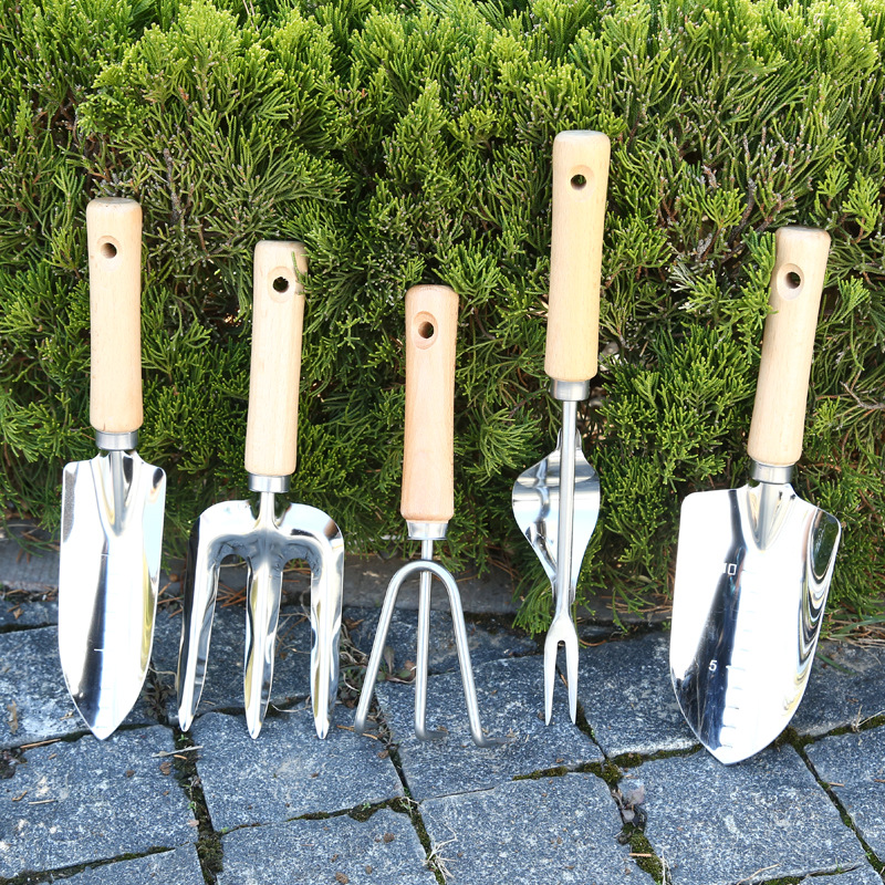 Mango de madera herramientas de jardinería de acero inoxidable traje de jardinería pala suelta Tenedor de tierra rastrillo de tres dientes herramientas de jardinería conjunto de cinco piezas