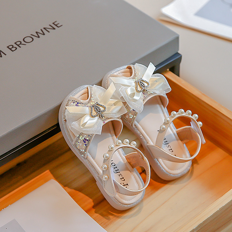 Summer 2023 Sweet Bow Princess Shoes Baotou Pearl Korean Style Girls' Sandals Hollow Breathable Non-slip Soft Sole