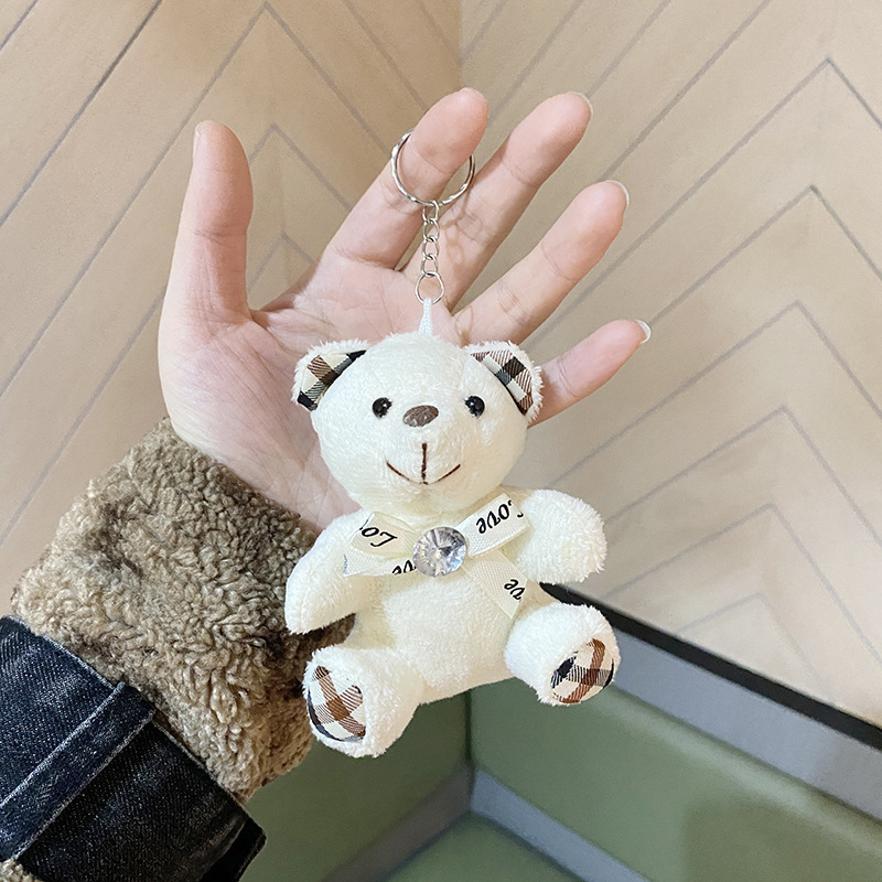 柔らかいぬいぐるみのおもちゃかわいい赤ちゃんパンダクマ赤いスカーフ蝶ネクタイを着て子供パンダ愛好家に適しています|undefined