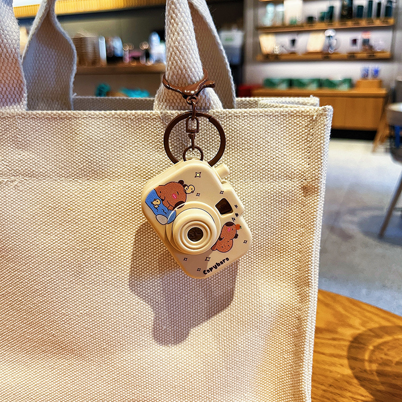 Original Capibala luminous projection camera keychain cute cartoon capybara bag pendant small gift