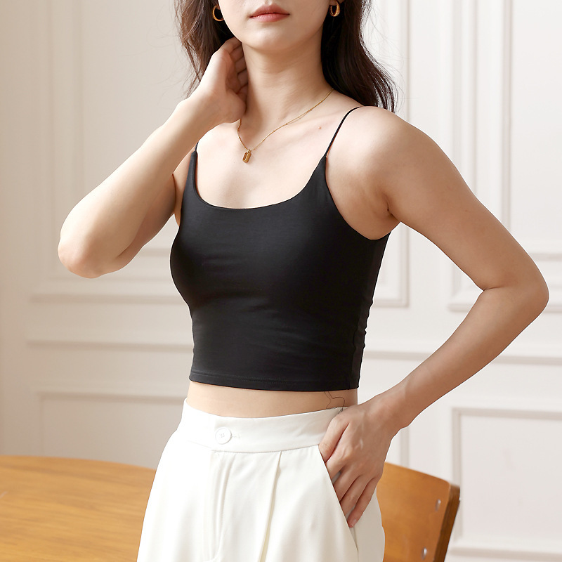 美背のガーターの女性の薄いタイプの白いの中に底の小さいベストを掛けます。|undefined