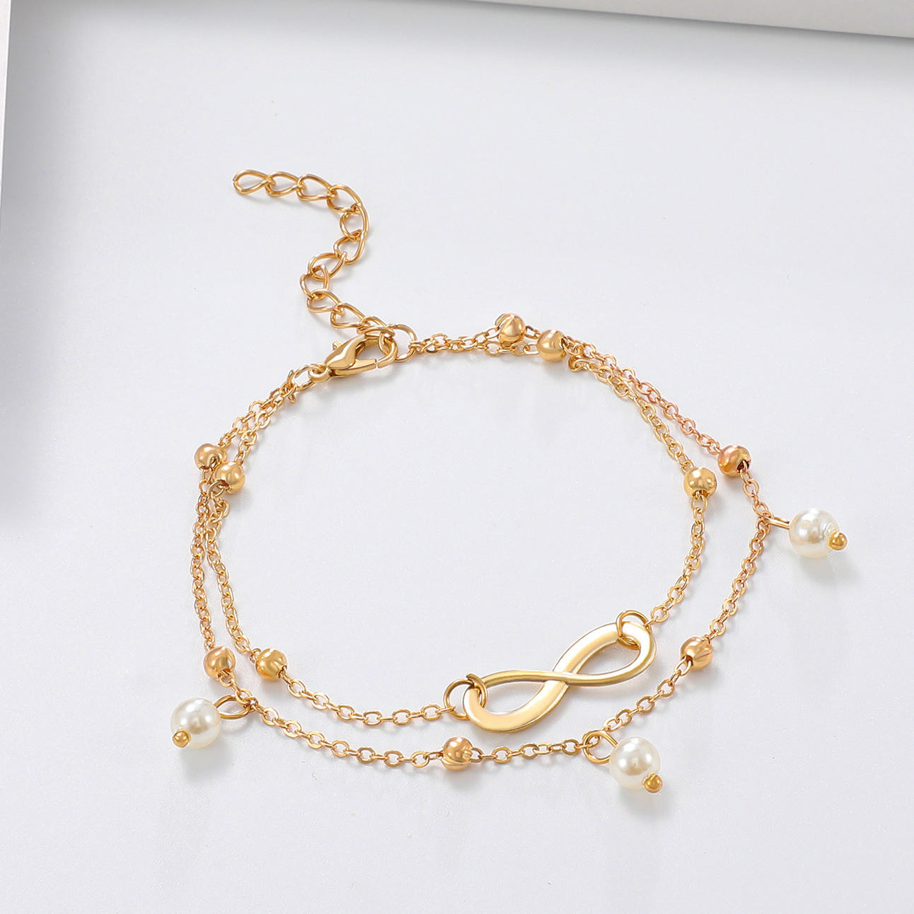 European and American fashion hot selling Pearl 8-word anklet jewelry women's handmade beaded double-chain foot jewelry beach foot jewelry wholesale