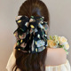 Yellow and green floral ribbon grip clip