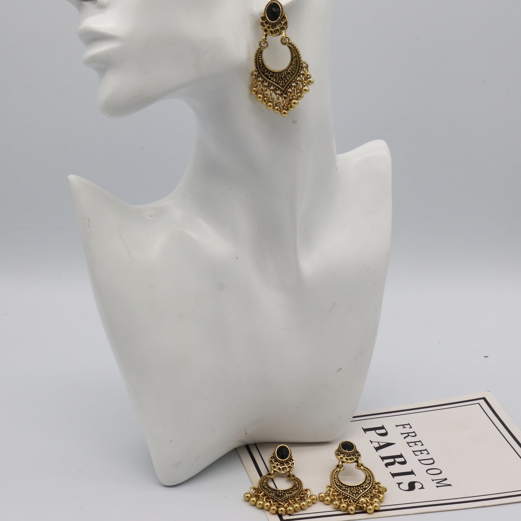 European and American cross-border jewelry fashion vintage earrings ethnic style carved beads black gem tassel earrings