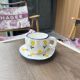 Yellow flower cup and saucer