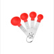 Red measuring spoon