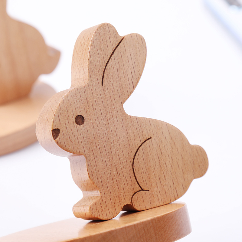 Solid wood flat support to chase TV cute creative mobile phone holder desktop mobile phone holder wholesale engraved logo