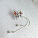 A silver tassel with colored beads