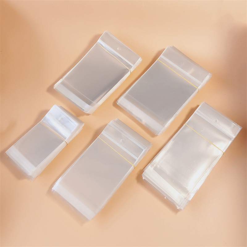 Opp bag collection with hanging hole sticky transparent bag adult children hair accessories hair clip jewelry packaging accessories materials