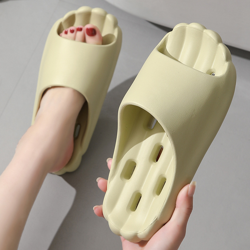 Bathroom quick-drying leaking slippers women's non-slip deodorant EVA material summer indoor bath hollow men's slippers wholesale
