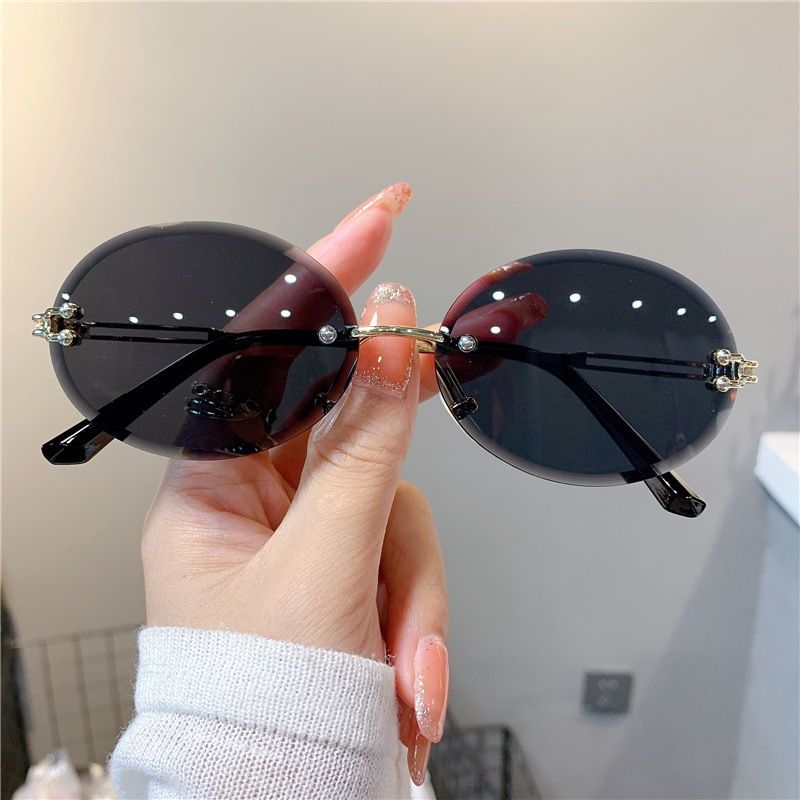 Nuevas gafas de sol transfronterizas para mujer, gafas de sol con degradado rojo ovalado en red, sin marco, gafas de moda al por mayor_voghion.com