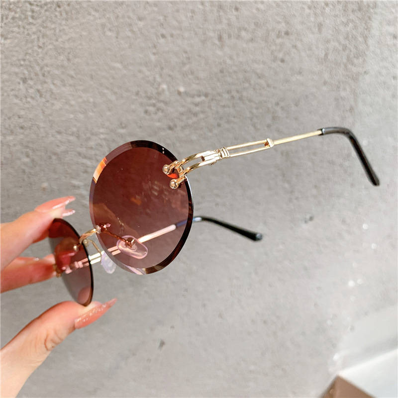 Nuevas gafas de sol transfronterizas para mujer, gafas de sol con degradado rojo ovalado en red, sin marco, gafas de moda al por mayor_voghion.com