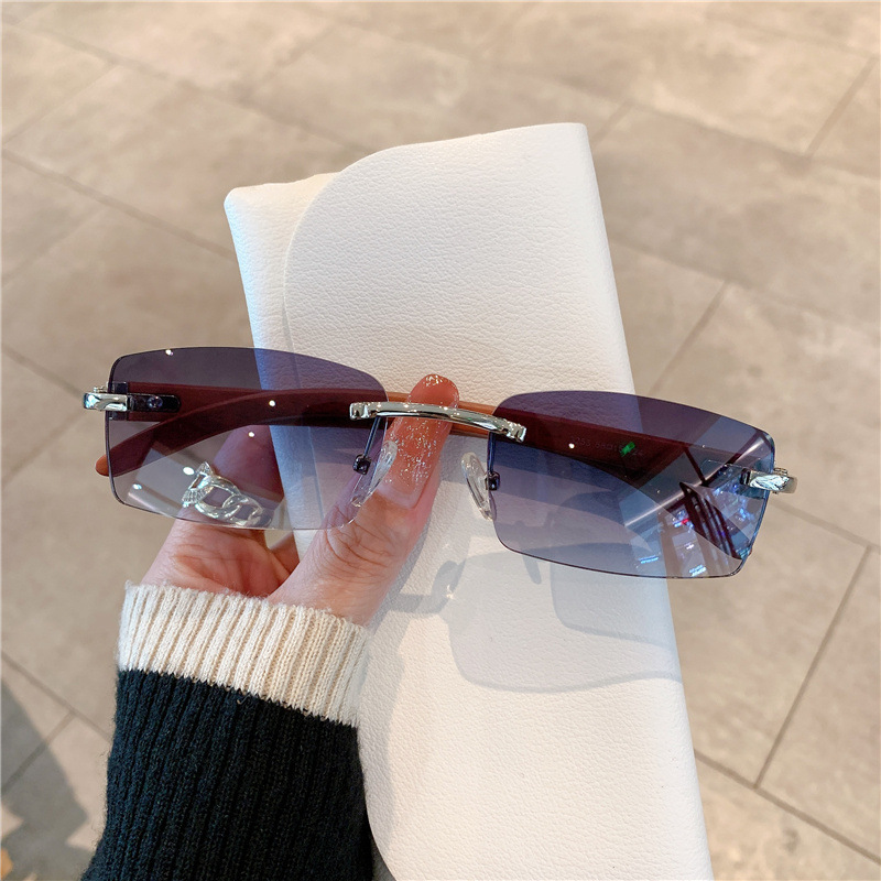 スポット卸売りファッションサングラス欧米の国境を越えた男女モデルは、木目の鏡脚サングラスを模したものではない|undefined