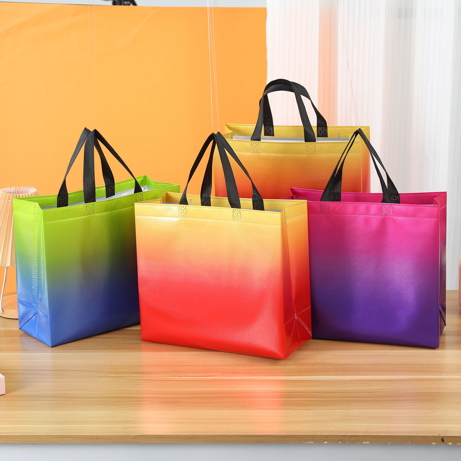 Cross-border gradient color laser laminating aluminum non-woven bag wholesale handbag printing logo gift bag shopping bag
