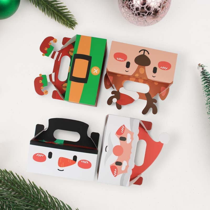 クリスマスシリーズのキャンディー箱クリスマスの新しい四角いプレゼント箱クリスマスの手にビスケットケーキの洋菓子箱を持っている|undefined