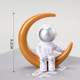 Plastic gold moon silver face astronaut