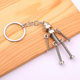 Factory wholesale robot retro handmade diy keychain pendant mobile robot movable screw man