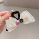 Rice white rhinestone bow grip clip