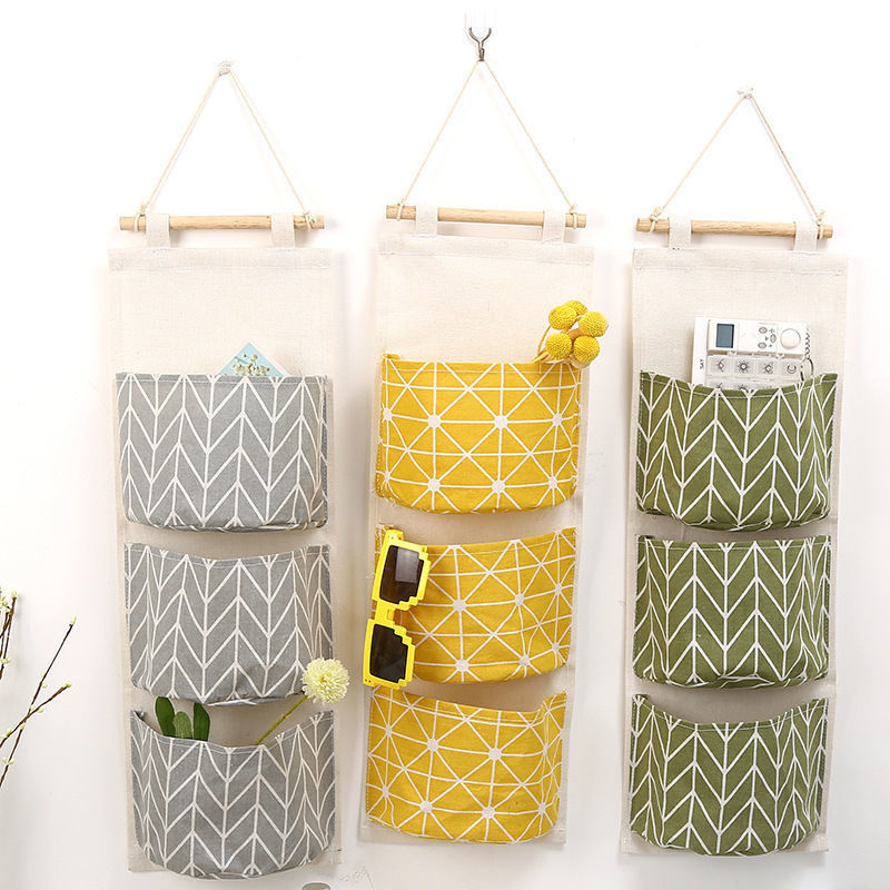 Waterproof cotton and linen storage hanging bag hanging fabric three-pocket hanging bag door sundries storage bag storage bag wholesale