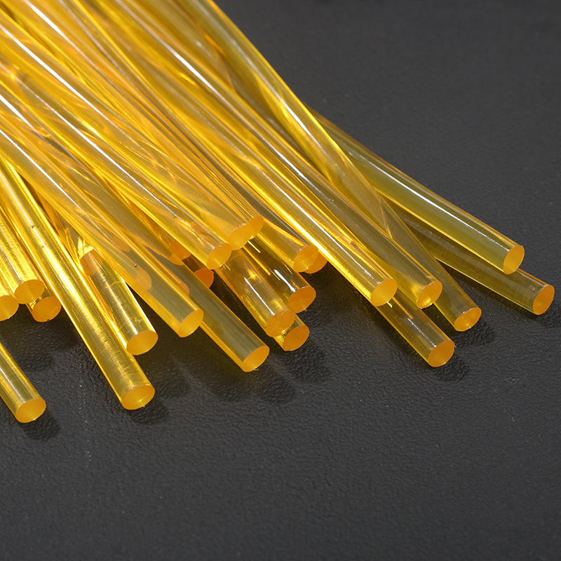 Spot wholesale golden yellow high transparent hot melt glue stick 7mm jewelry metal high viscosity thermoplastic resin adhesive