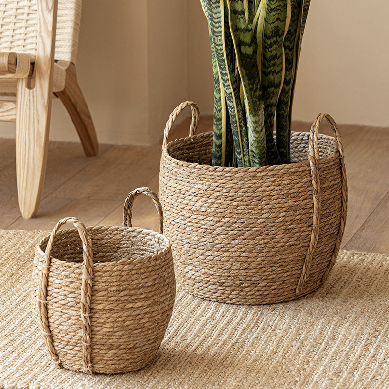 Wholesale pastoral style sea grass woven handmade flower basket with handle Rattan woven decorative flower pot large laundry basket clothes collection