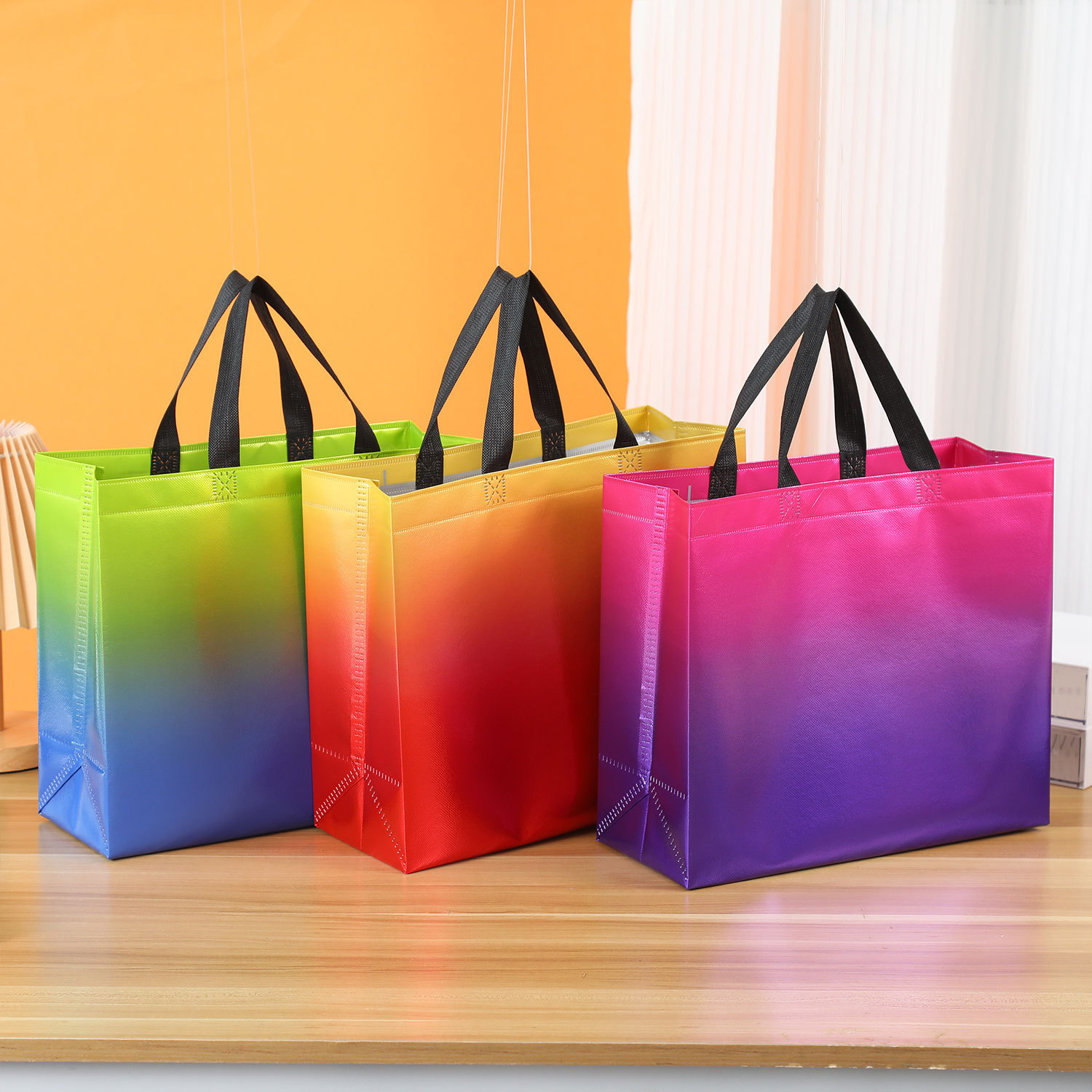 Cross-border gradient color laser laminating aluminum non-woven bag wholesale handbag printing logo gift bag shopping bag