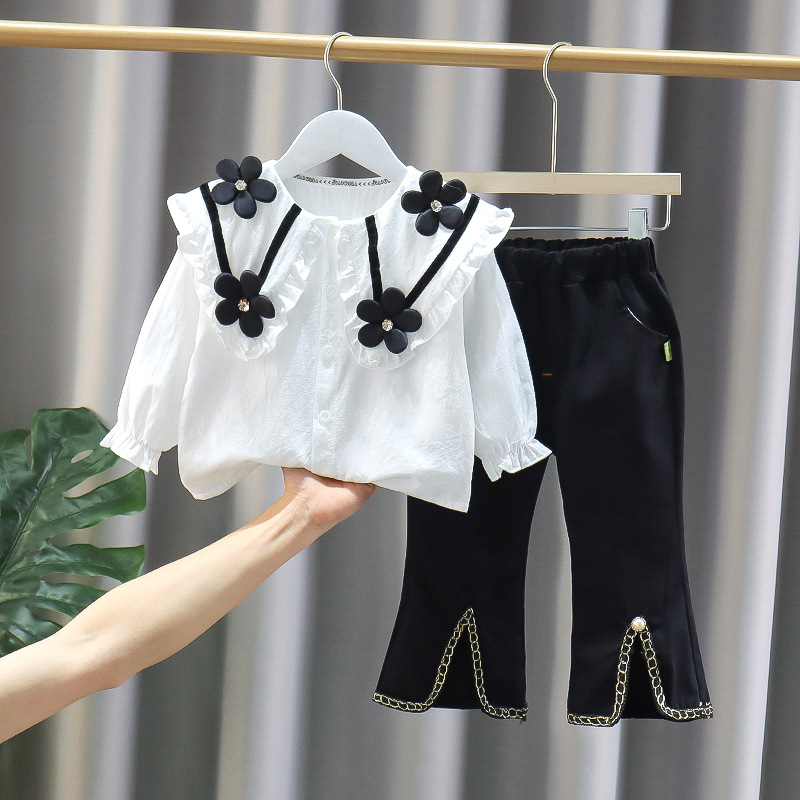 In the spring and autumn of 2023 new children's clothing doll collar black small flower long sleeve jacket casual trousers two-piece wholesale