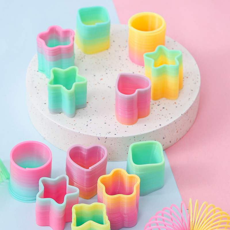 Factory Direct Sales small size magic rainbow circle student educational toys mini shaped spring ring night market stall supply
