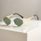 Gold frame dark green film (black feet)